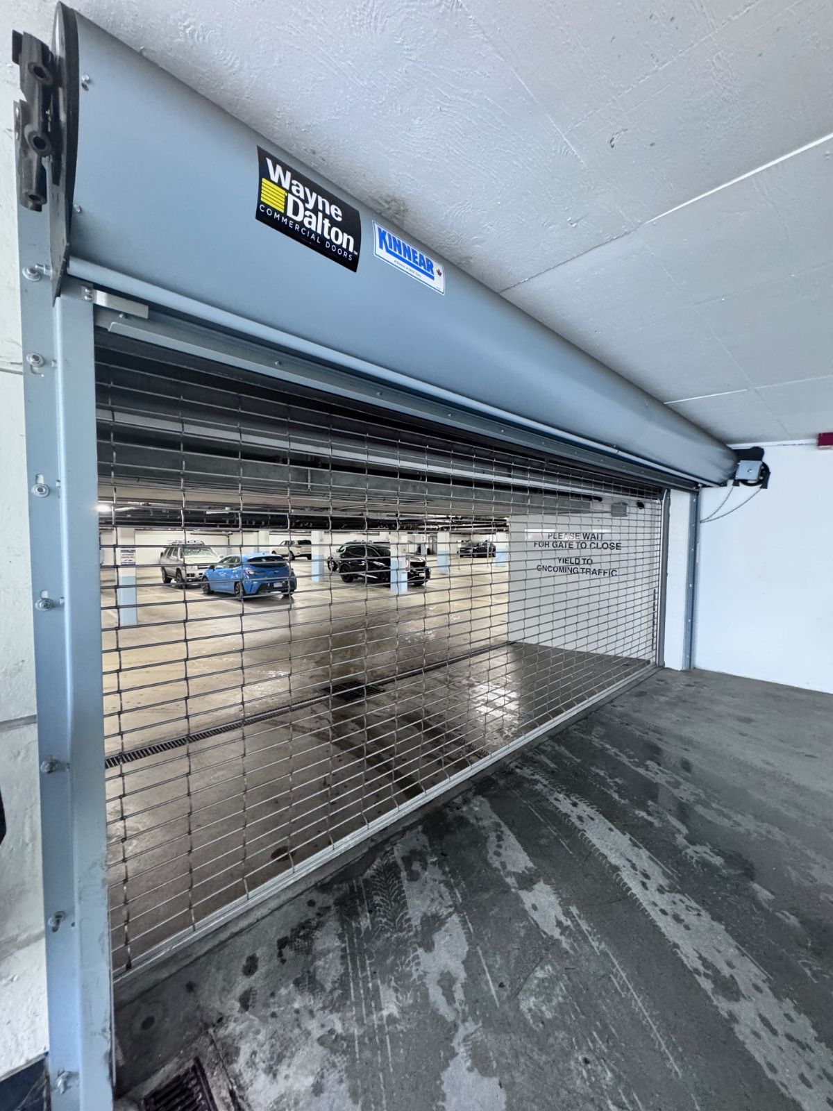 Commercial roll-up door service on a Coquitlam strata parkade
